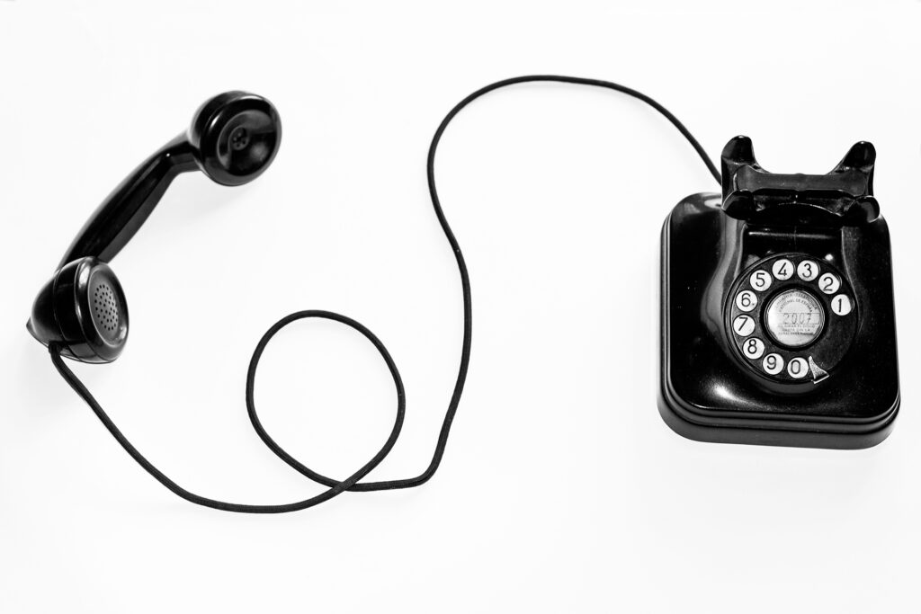 Classic black telephone on a white background