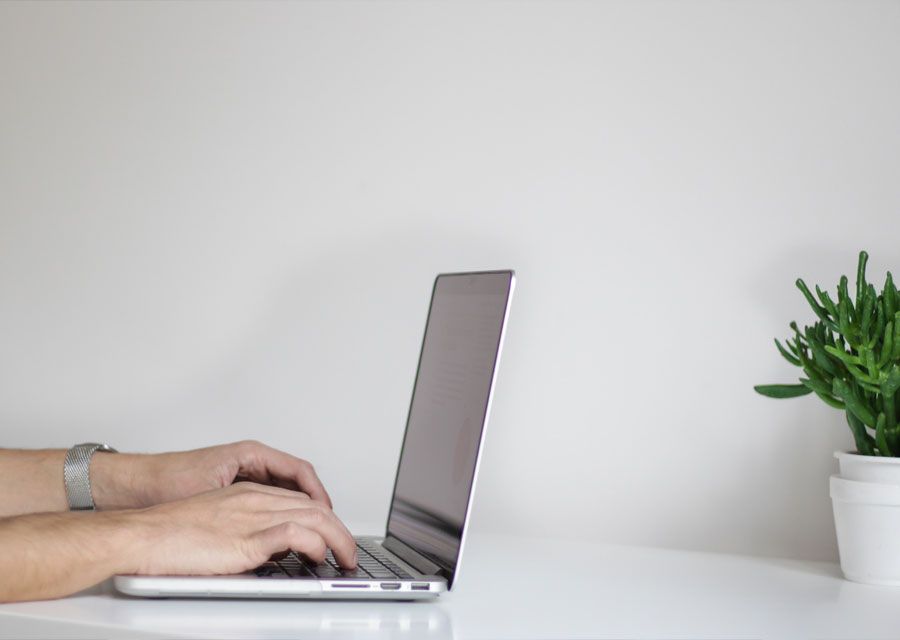 Web developer building a WordPress website on a laptop